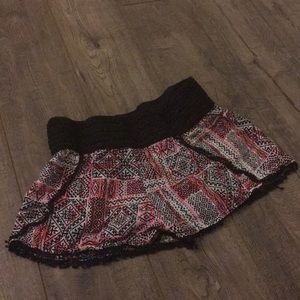 Pink and blue shorts with black print and trim